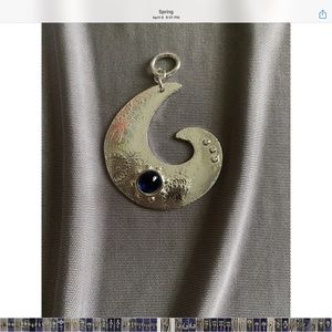 Handcrafted pendant with blue sapphire